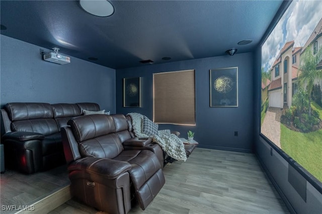 home theater with light hardwood / wood-style floors