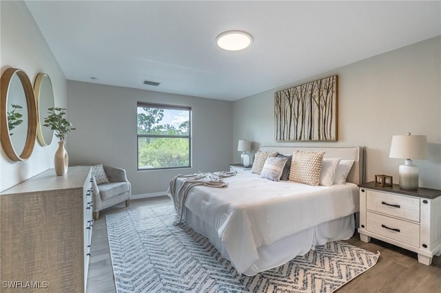 bedroom featuring dark hardwood / wood-style floors