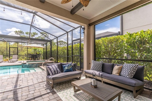 view of patio / terrace with glass enclosure, ceiling fan, and an outdoor hangout area