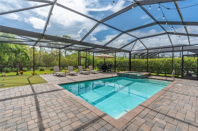 view of pool with an in ground hot tub, glass enclosure, and a patio area