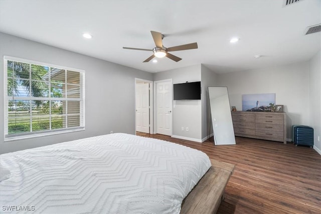 bedroom featuring ceiling fan, baseboards, wood finished floors, and recessed lighting