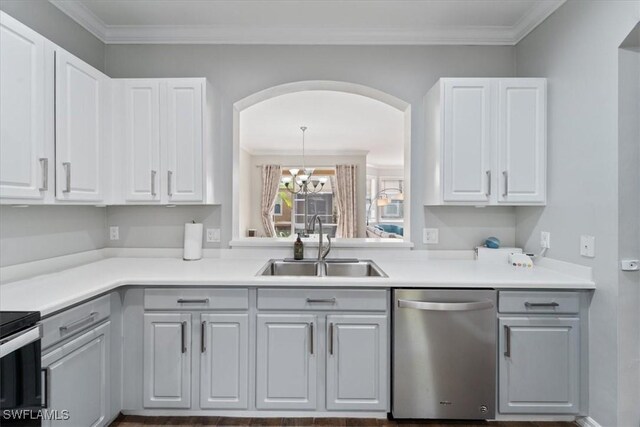 kitchen featuring white cabinets, dishwasher, ornamental molding, and sink