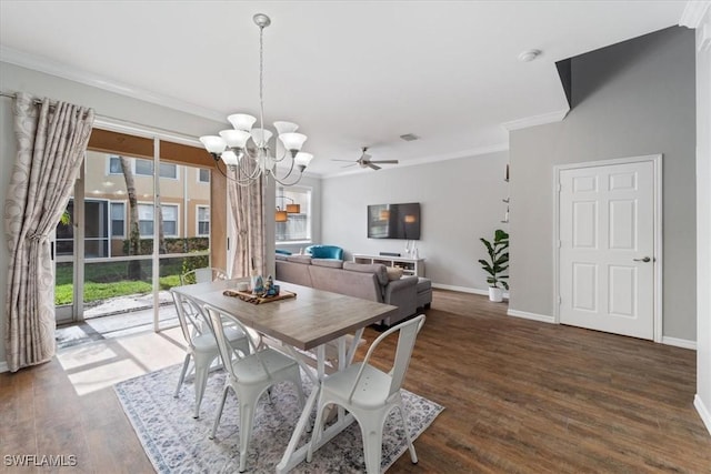 dining space featuring crown molding, dark wood-type flooring, and ceiling fan with notable chandelier