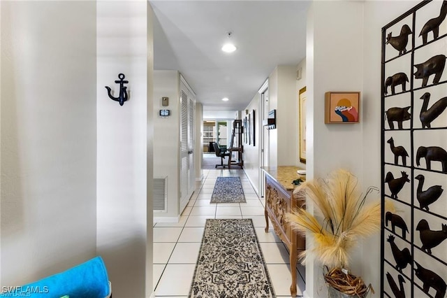 corridor featuring light tile patterned flooring