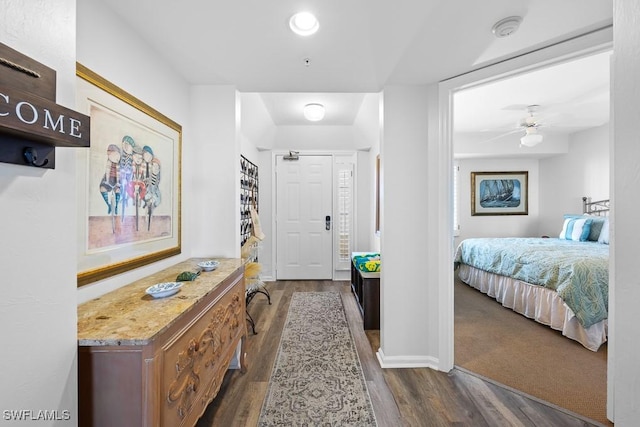 hallway featuring dark hardwood / wood-style floors