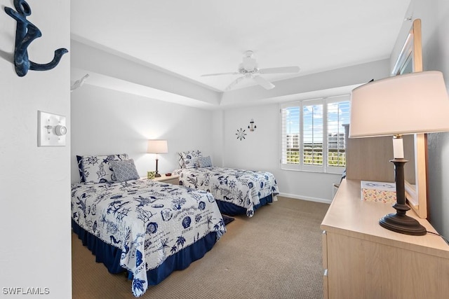 bedroom featuring ceiling fan and light carpet