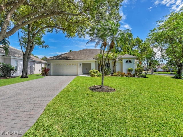 ranch-style home with a front lawn and a garage