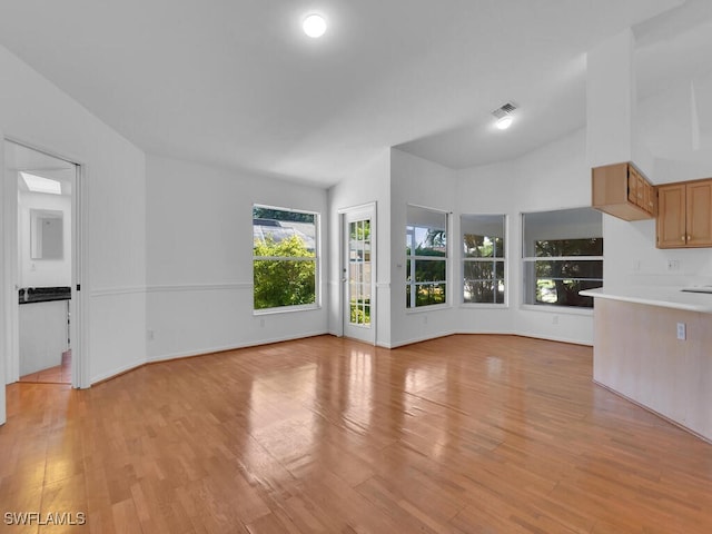 unfurnished living room featuring light hardwood / wood-style flooring