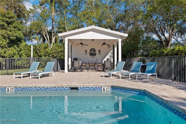 8526 Mustang Dr, Naples, FL 34113 - community pool with a patio, fence, and ceiling fan