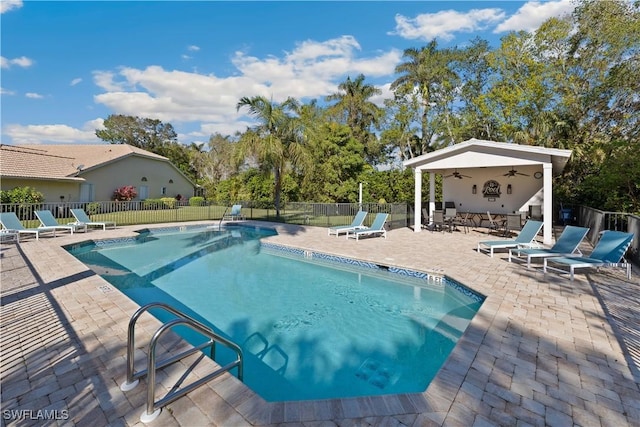 8526 Mustang Dr, Naples, FL 34113 - pool featuring a patio area, fence, and a ceiling fan