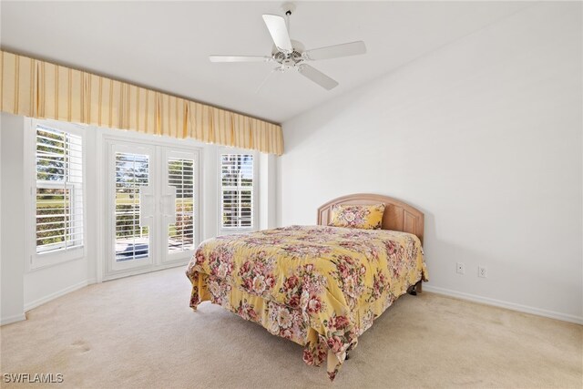 8526 Mustang Dr, Naples, FL 34113 - bedroom featuring multiple windows, carpet floors, and access to exterior