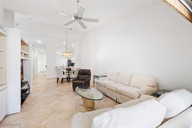 8526 Mustang Dr, Naples, FL 34113 - living room with light tile patterned flooring, ceiling fan with notable chandelier, vaulted ceiling, and recessed lighting