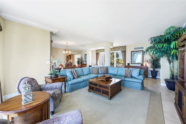 living room featuring an inviting chandelier