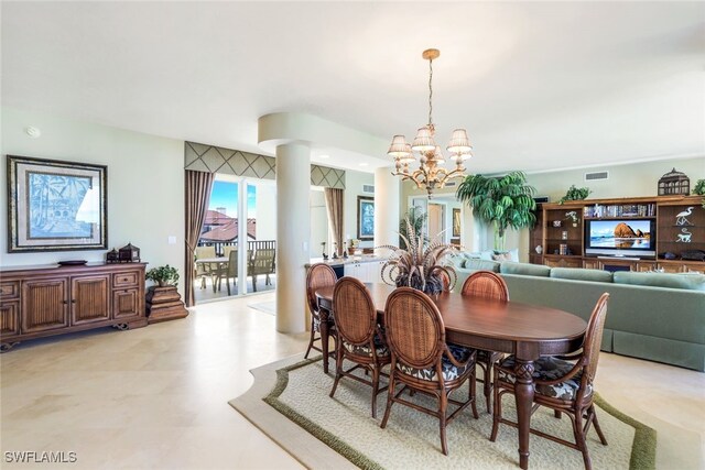 dining room with a notable chandelier and decorative columns