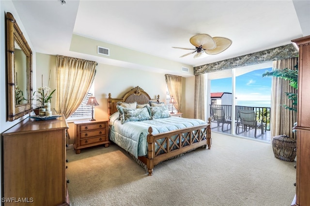 carpeted bedroom featuring access to outside and ceiling fan