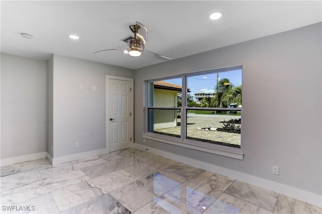 unfurnished room featuring ceiling fan