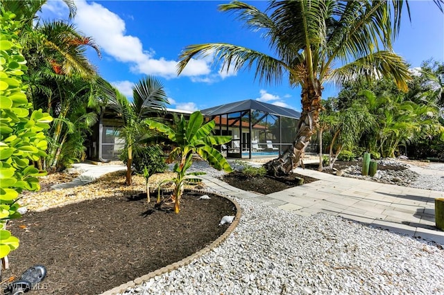 view of yard featuring glass enclosure