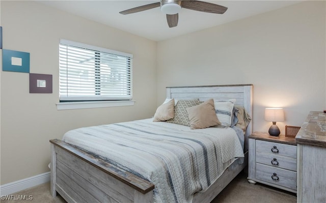 bedroom featuring light carpet and ceiling fan