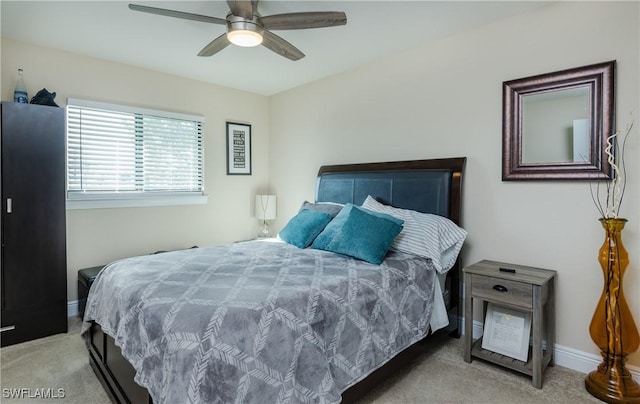 bedroom featuring ceiling fan and light colored carpet