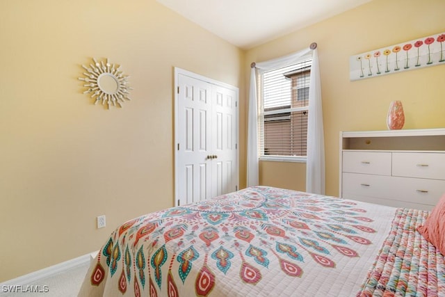 bedroom with carpet floors and a closet