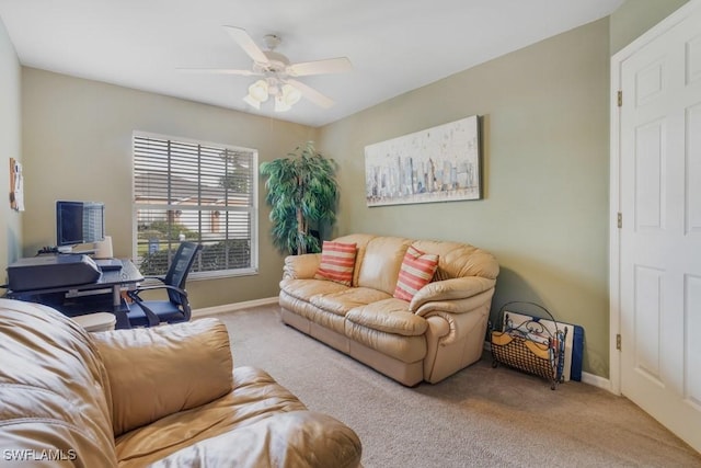 carpeted living room with ceiling fan