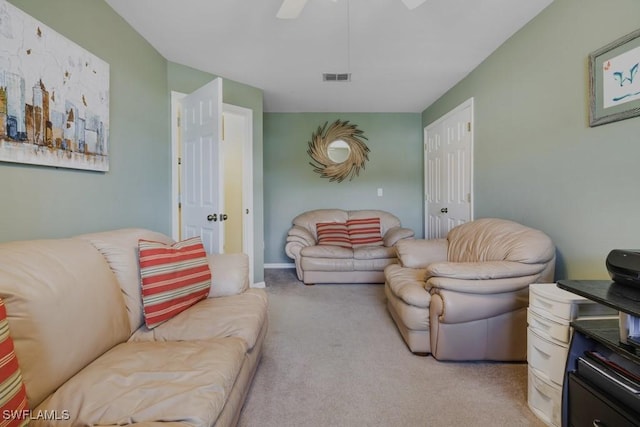 living room with light carpet and ceiling fan