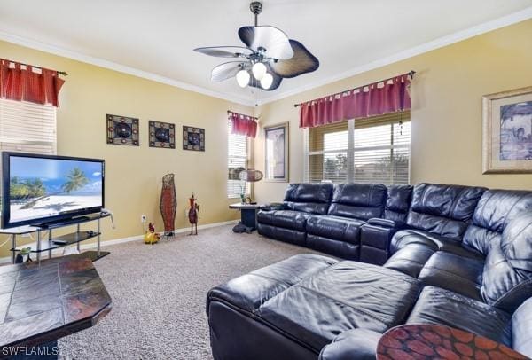 carpeted living room with ceiling fan and crown molding