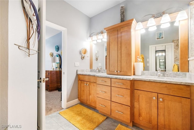 bathroom with tile patterned flooring and vanity