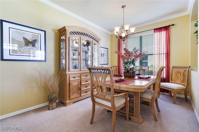 dining space featuring crown molding, carpet, and an inviting chandelier