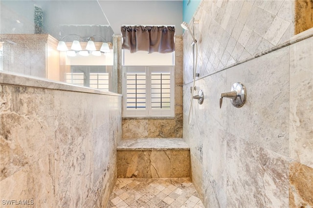 bathroom featuring a tile shower