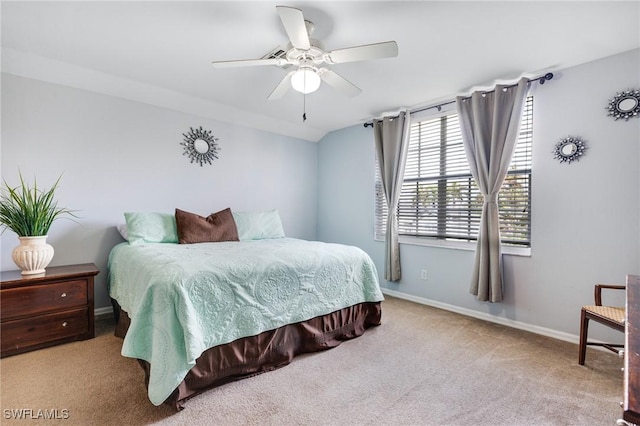 bedroom featuring ceiling fan, light carpet, and vaulted ceiling