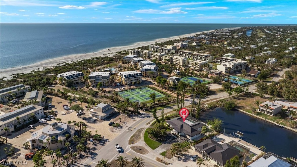 aerial view featuring a water view and a beach view