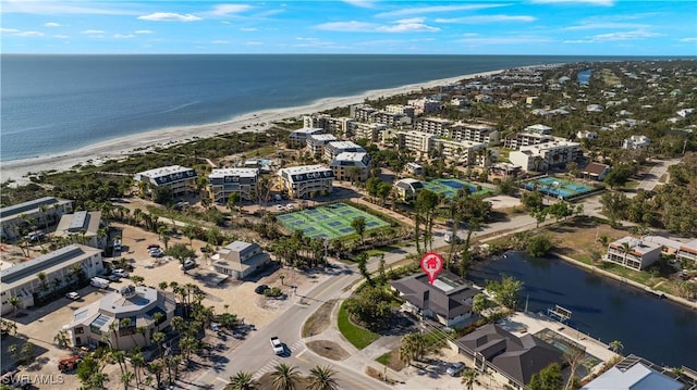 aerial view featuring a water view and a beach view