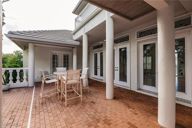 view of patio featuring covered porch and french doors