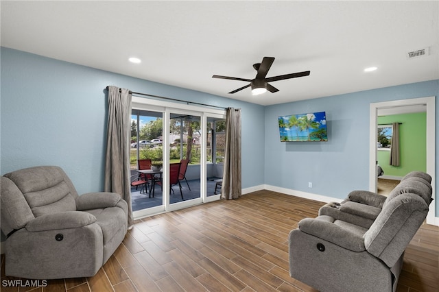 living room featuring ceiling fan