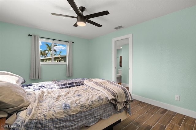 bedroom featuring ceiling fan and ensuite bathroom