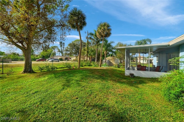 view of yard with a sunroom