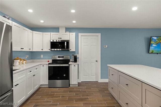 kitchen featuring white cabinets and appliances with stainless steel finishes