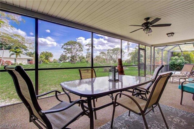 15188 Sam Snead Ln, North Fort Myers, FL 33917 - sunroom with outdoor dining area and ceiling fan