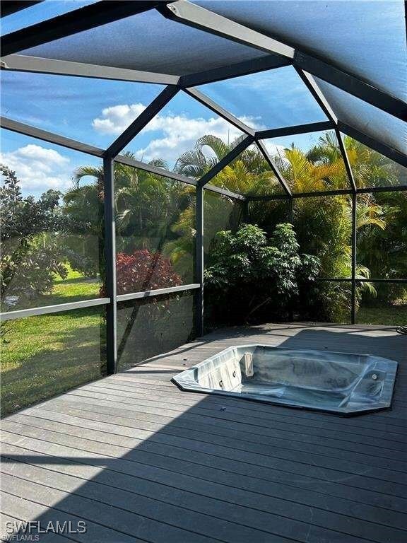 15188 Sam Snead Ln, North Fort Myers, FL 33917 - exterior space with a jacuzzi and a lanai