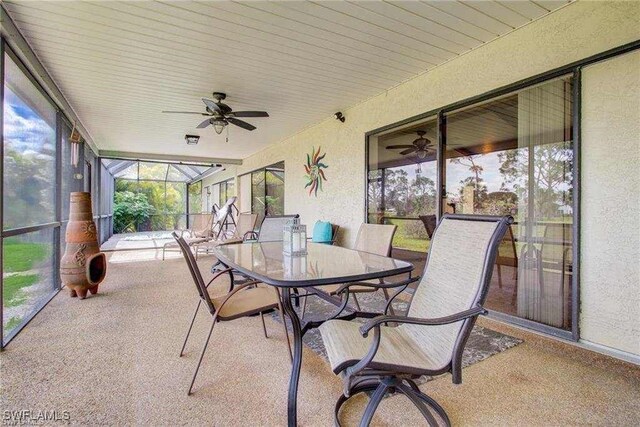 15188 Sam Snead Ln, North Fort Myers, FL 33917 - sunroom featuring outdoor dining area, ceiling fan, and a healthy amount of sunlight