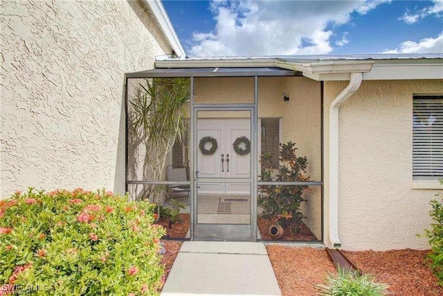 15188 Sam Snead Ln, North Fort Myers, FL 33917 - entrance to property with stucco siding