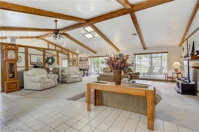 carpeted living room with ceiling fan, beamed ceiling, and high vaulted ceiling