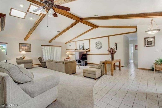 tiled living room featuring lofted ceiling with beams and ceiling fan