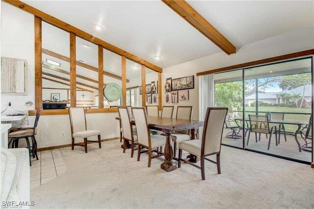 15188 Sam Snead Ln, North Fort Myers, FL 33917 - carpeted dining room featuring baseboards and lofted ceiling with beams
