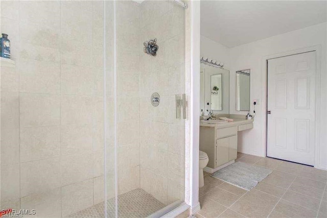 15188 Sam Snead Ln, North Fort Myers, FL 33917 - full bathroom featuring vanity, toilet, tile patterned floors, and a stall shower