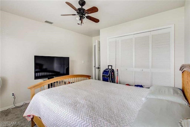 carpeted bedroom with a closet and ceiling fan