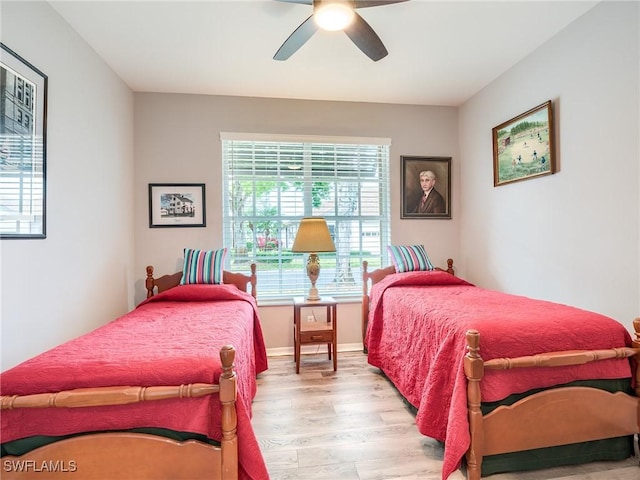 bedroom featuring light hardwood / wood-style floors and ceiling fan