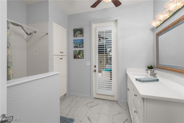 bathroom featuring vanity, ceiling fan, and a shower