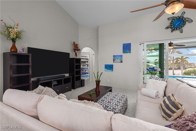 living room with lofted ceiling and ceiling fan